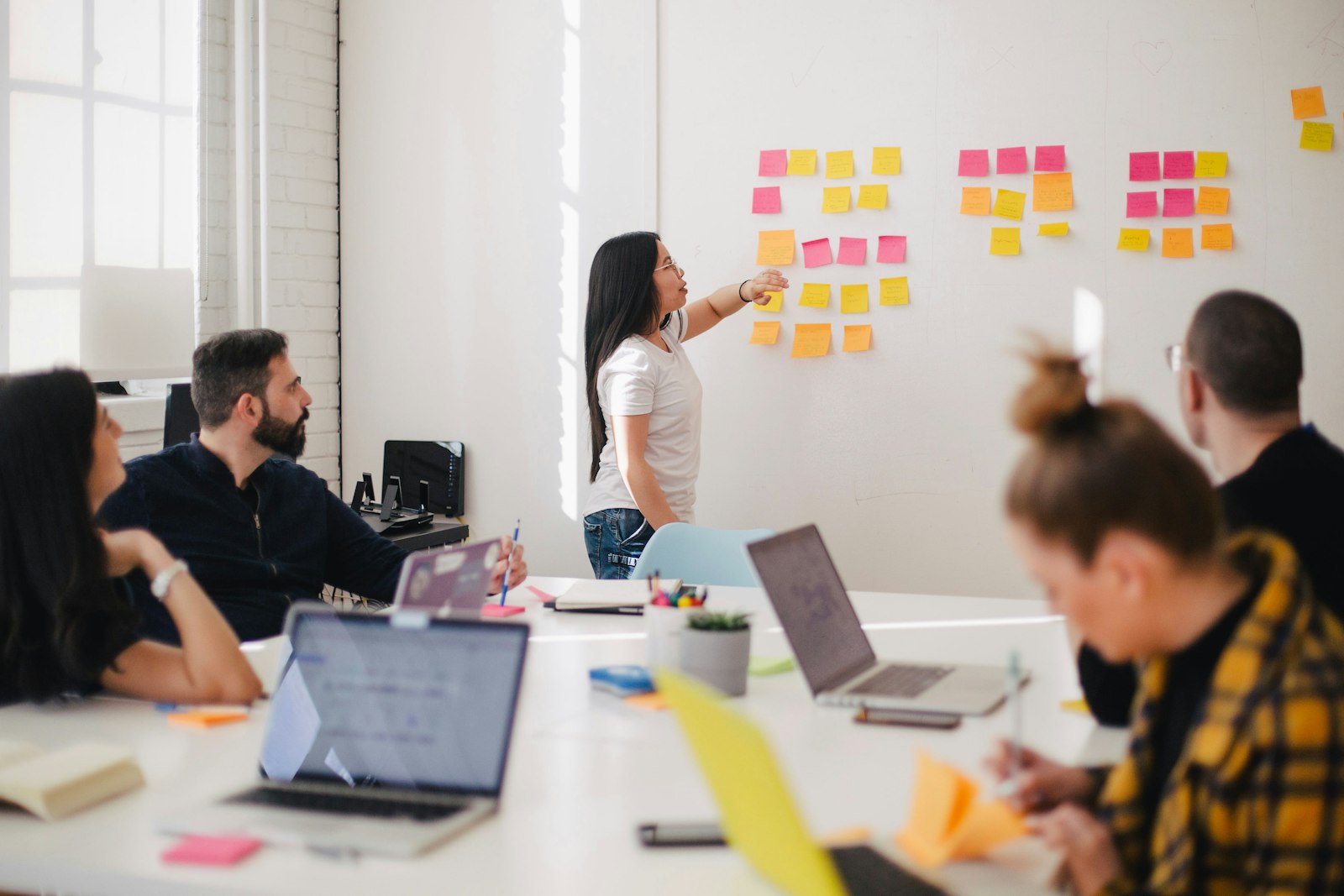 Diverse team of entrepreneurs collaborating around a modern office table.